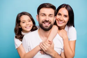 family of three smiling