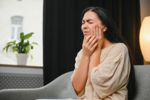 Woman with severe tooth pain