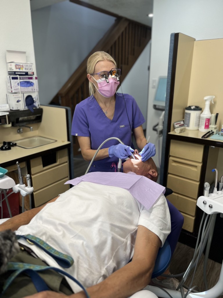 Largo Dentist, Cleaning Patients teeth