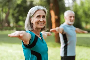 Couple Doing Yoga in the park
